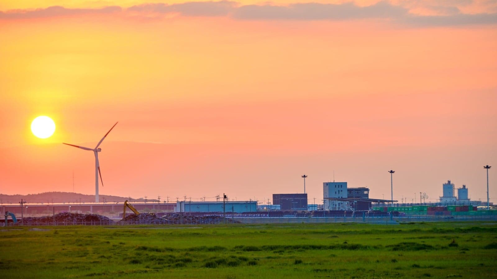 Wind turbine powering nearby factories