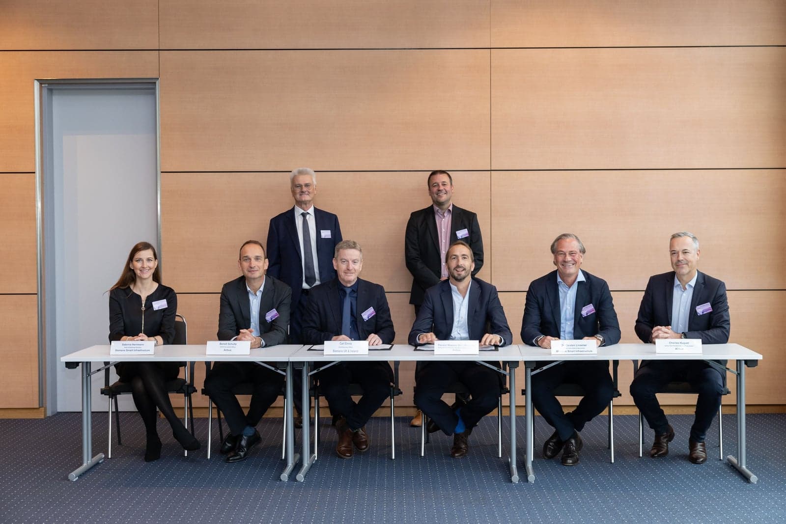 Left to right: Sabrina Herrmann - Head of Buildings Germany, Siemens Smart Infrastructure; Benoit Shultz - Chief Procurement Officer, Airbus; Herbert Klipp - Corporate Account Manager, Siemens; Carl Ennis - CEO Siemens UK & Ireland; Jan Schwarz - Vice President Real Estate & Facility Management Procurement, Airbus; Florent Massou dit Labaquère, EVP Operations Commercial Aircraft, Airbus; Carsten Liesener - Global Head Sales & Operations, Siemens Smart Infrastructure; Charles Huguet - Senior Vice President General Procurement, Airbus