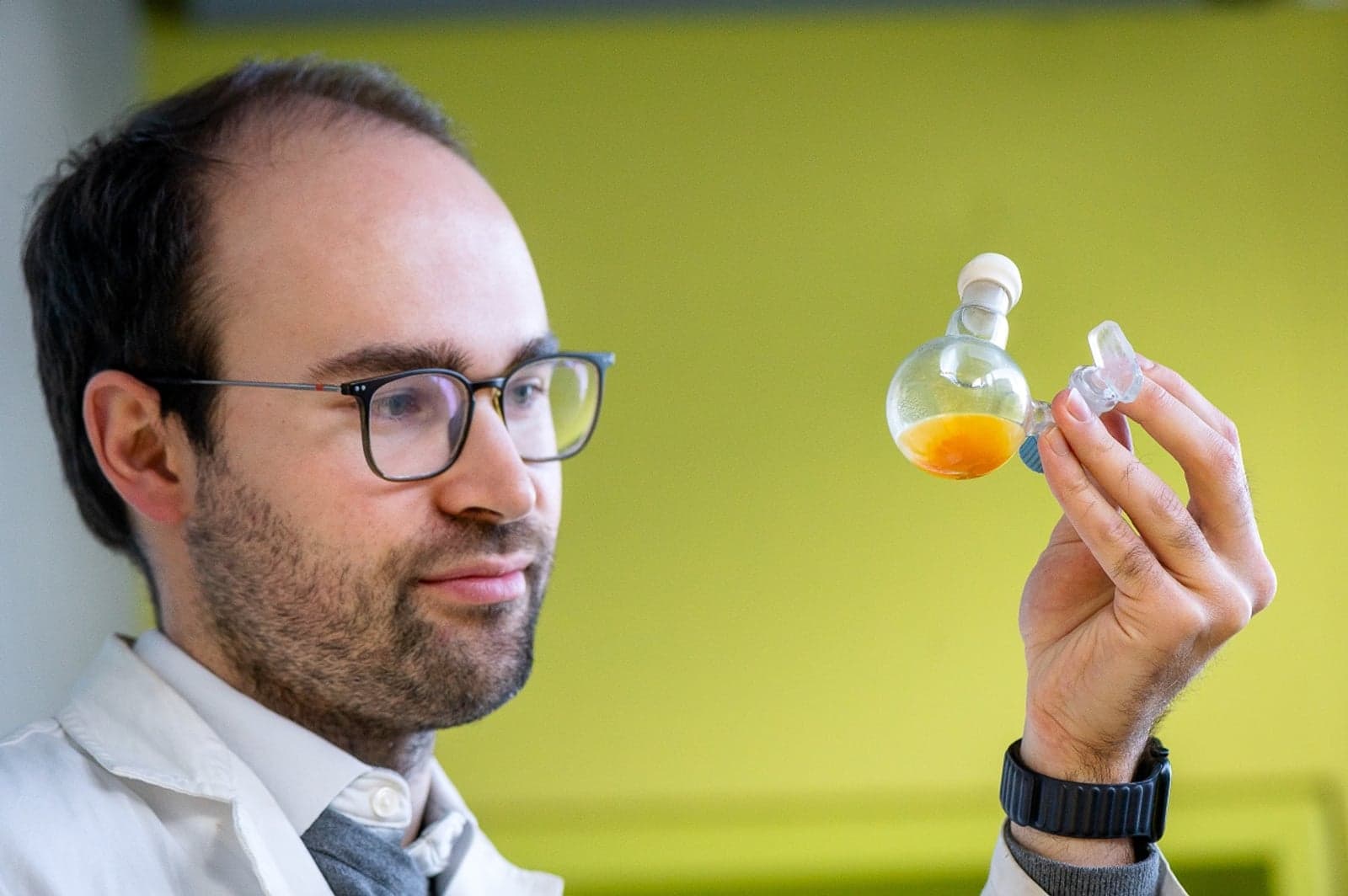 Dr Philip Stanley in the laboratory with the yellow powder.